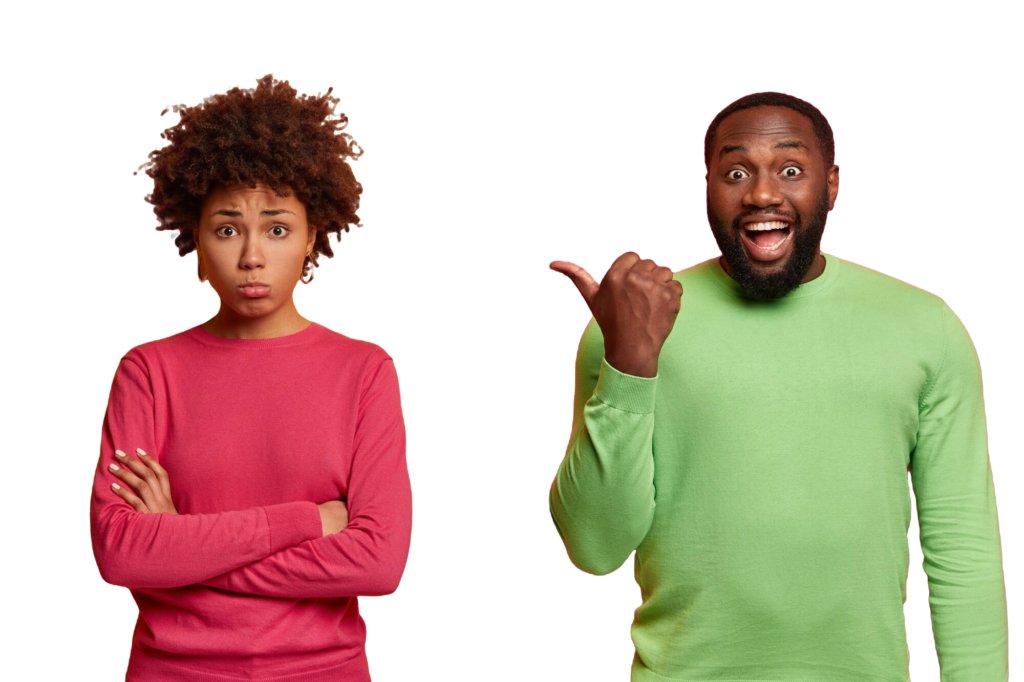 A woman with a sad and confused expression, arms crossed, standing next to a man who is smiling broadly and pointing at her with enthusiasm.